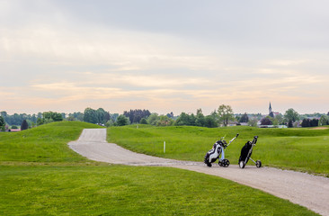 Golfcourse in Germany with two golfbags