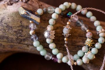 Natural gemstone beads bracelets on wooden background