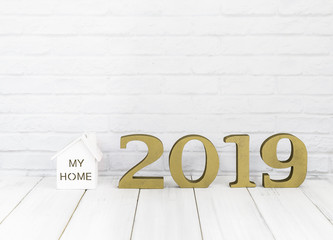2019 new year and home  on white wood table over white background with copy space , Real estate concept
