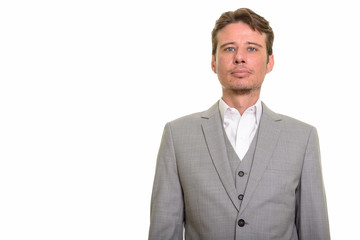 Handsome and confident Caucasian businessman looking at camera