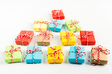 Christmas tree of colorful gift boxes on white background