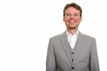 Happy Caucasian businessman looking at camera while smiling