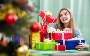 Fototapeta na wymiar Happy girl with Christmas gifts and presents