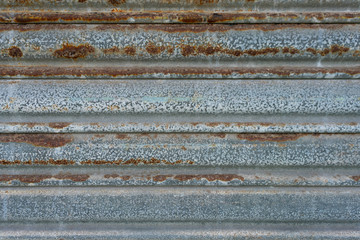 Close up of decaying rusted metal shutter door