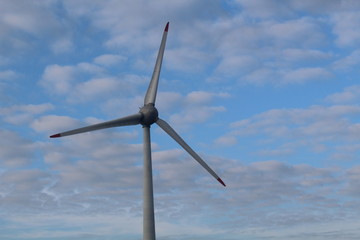 Windmill in front of a hazy autumn sky 