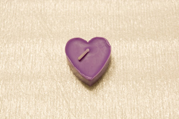 candles are burning purple on a white background