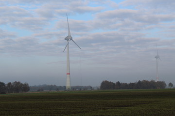 Windmill in front of a hazy autumn sky 