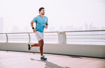 Beautiful man doing work out and different exercises outdoor