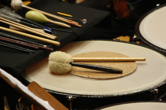 Timpani and different sizes of timpani mallets, drum brushes and maracas. Detail of percution rods and mallets.