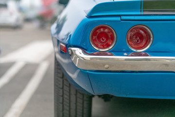 Close up of vintage blue car bumber and rear lamps