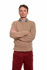 Handsome Caucasian man with arms crossed looking at camera