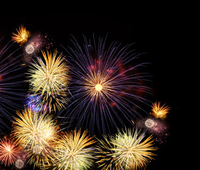 Fireworks colorful explosions on black, festive background