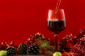 Christams Holiday Red Wine on Wood Table and Christmas Tree