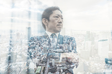 Double exposure with business man and tokyo view