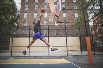 Basketball player training on a court in New york city © oneinchpunch