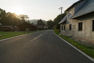 Street with road and houses in the village. Czech Republic