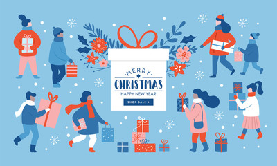 Christmas sale concept. People dressed in winter clothes shopping for Christmas holiday.