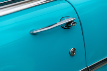 Close up of blue vintage car door