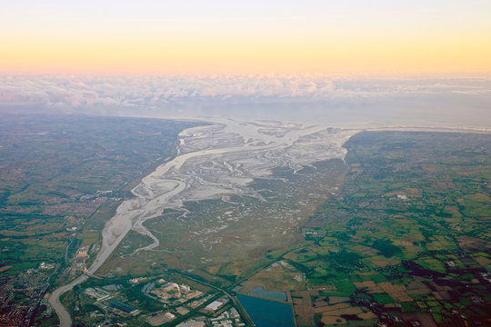 Aerial shot of the Dee estuary and the Wirral, England, UK, evening light.