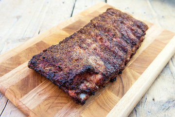St Louis style grilled pork ribs on cutting board