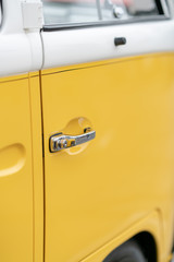 Close up of yellow vintage car door