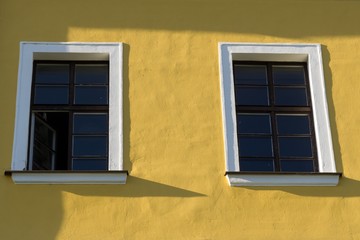 Windows on the yellow building. Czech Republic