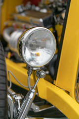 Close up of vintage yellow car bumber and lamps