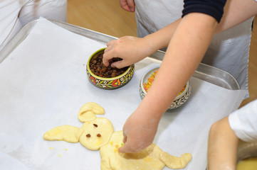 Young children make dough products. Hands closeup
