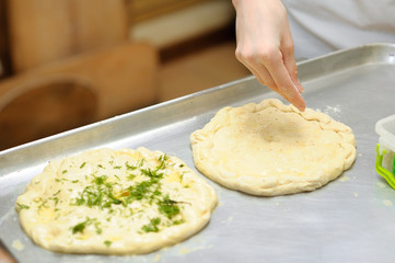 Young children make dough products. Hands closeup
