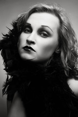 Duotone portrait of young beautiful woman with vintage style make-up