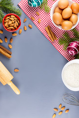 Christmas cookie ingredients, rolling pin and cookie cutters. Christmas cooking concept. Copy space