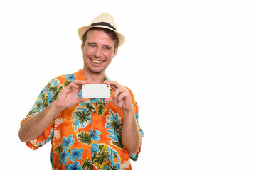 Happy Caucasian man taking picture with mobile phone ready for v