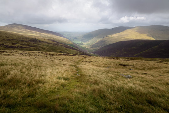View into the valley from high pike with rough weather England