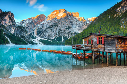 Spectacular wooden boathouse on the alpine lake, Dolomites, Italy, Europe