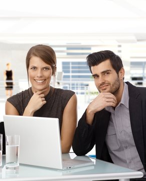 Businessman and businesswomen with laptop computer