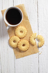 Cookies and coffee on white table