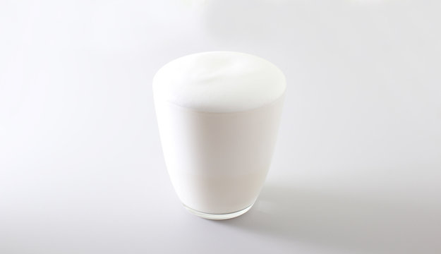 Milk Foam Glass On A Light Background