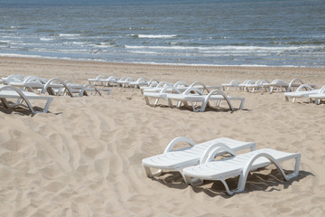 Fototapeta na wymiar beach chairs for rental