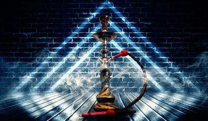 Hookah smoking on the background of an empty grunge wall, neon l