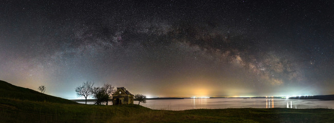 Milky way panorama over an abandoned church
