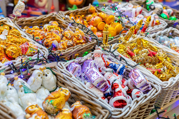 Various decorations and souvenirs on christmas market. Xmas fair. Festive Holiday. Christmas market, fair. Close up.
