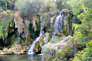 Beautiful Kravica waterfall in Bosnia and Herzegovina - popular swimming and picnic area for tourists