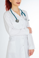  Female doctor with red hair. Isolated white background. stethoscope file and white uniform
