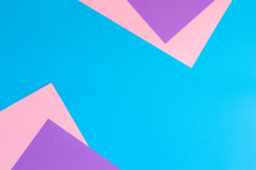 Color papers geometry flat composition background with pink violet and blue tones