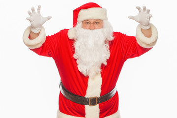 Shocked Santa Claus raising his hands scares, isolated on white 