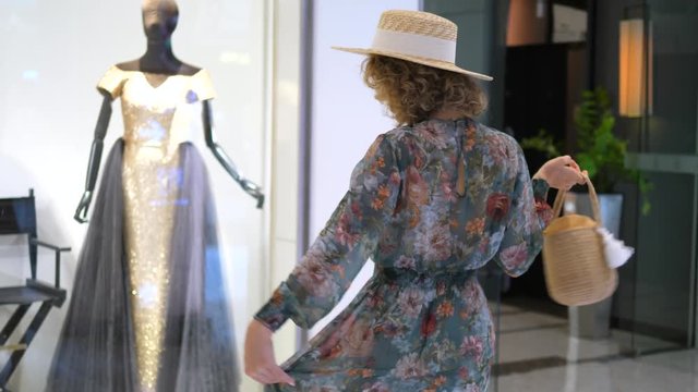 Woman Looking At Boutique Showcase While Shopping