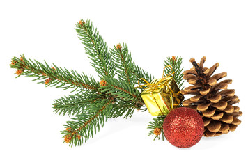Christmas decoration on white background - fir tree branch, pine cone, red christmas ball and golden gift box.