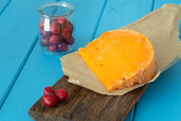 Mimolette,  type of cheese together with the addition of bread and fresh cranberries