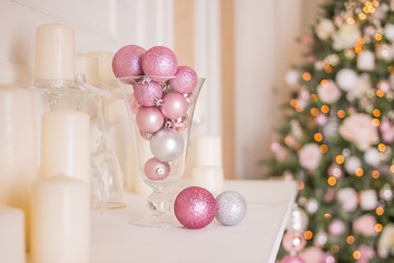 Photo of romantic holiday interior design, traditional Christmas tree, white candles, luxury silver...