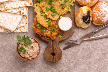 Tasty Hanukkah celebration food on vintage cutting board